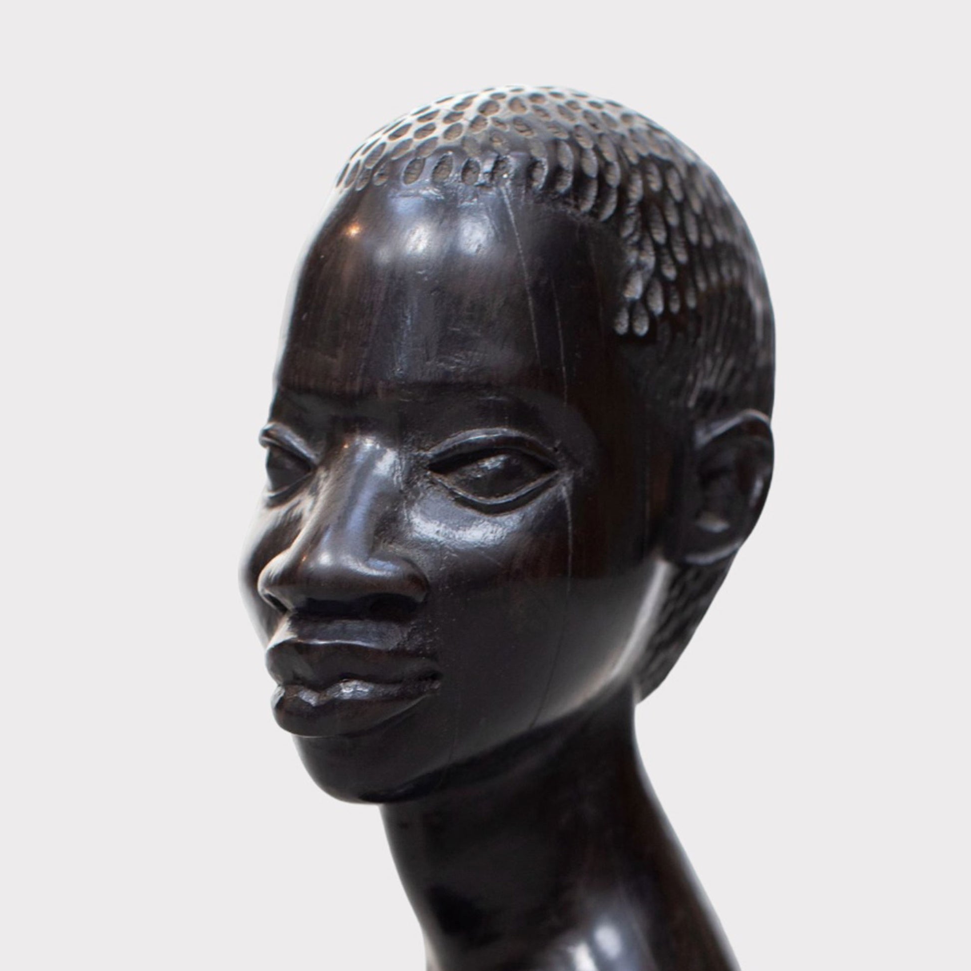 close up of a Vintage Carved African Ebony Bust