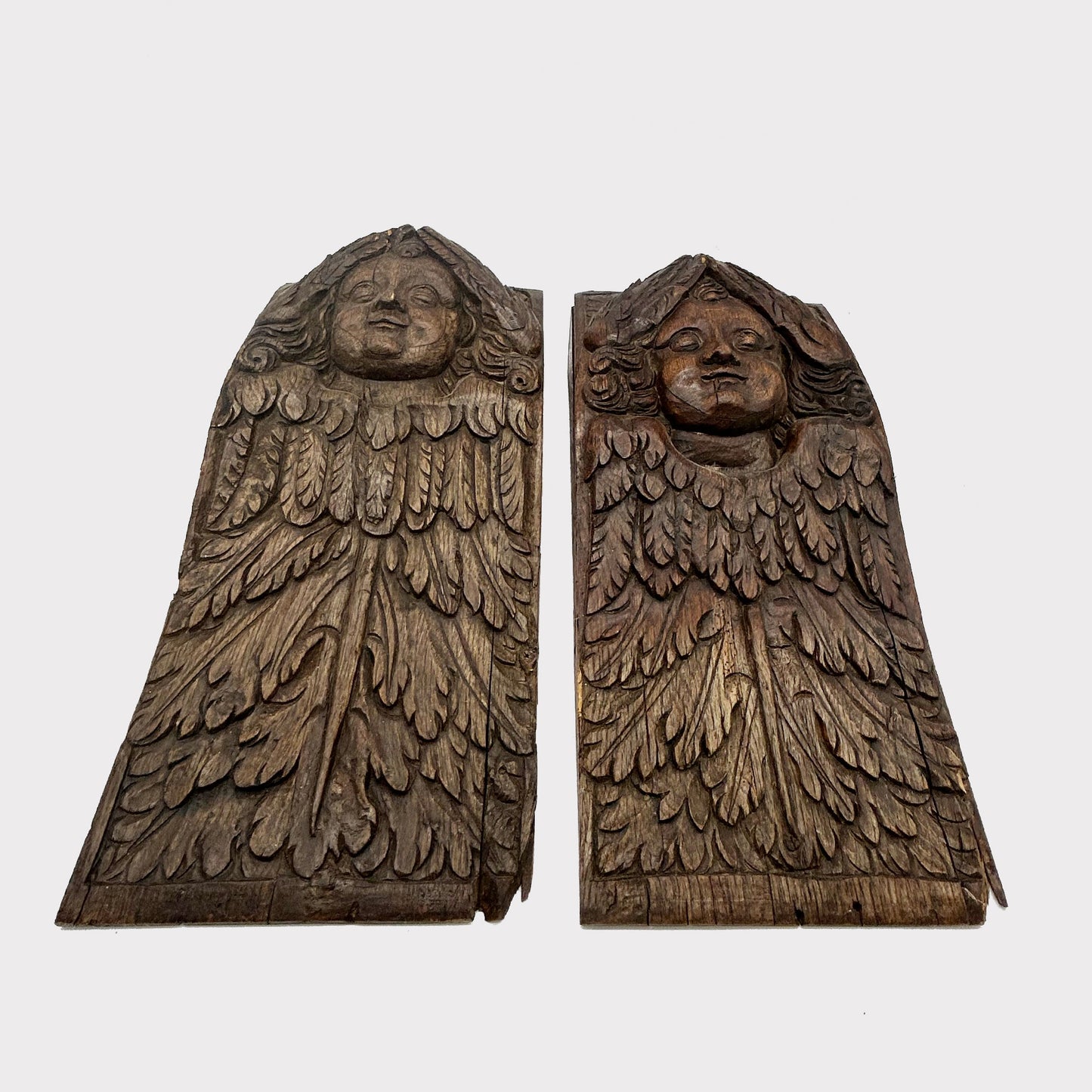 bottom view of Antique Carved Wood Angel Corbel Pair