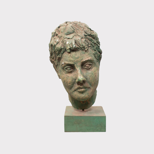 roman head plaster bust on a mount with virdigris finish