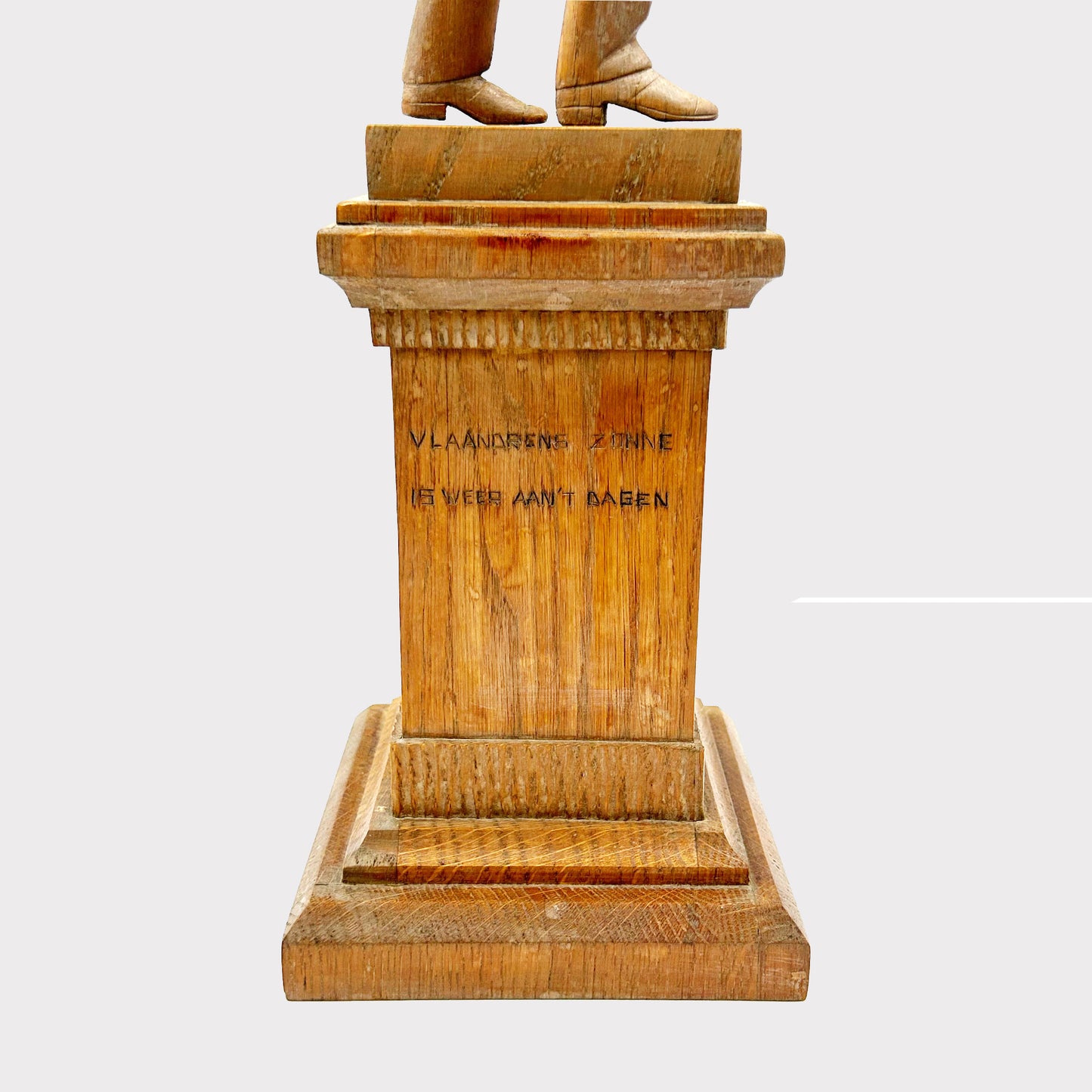 carved text view of Wooden Statue of a Man with an inscription on the base his hand is raised up over his head