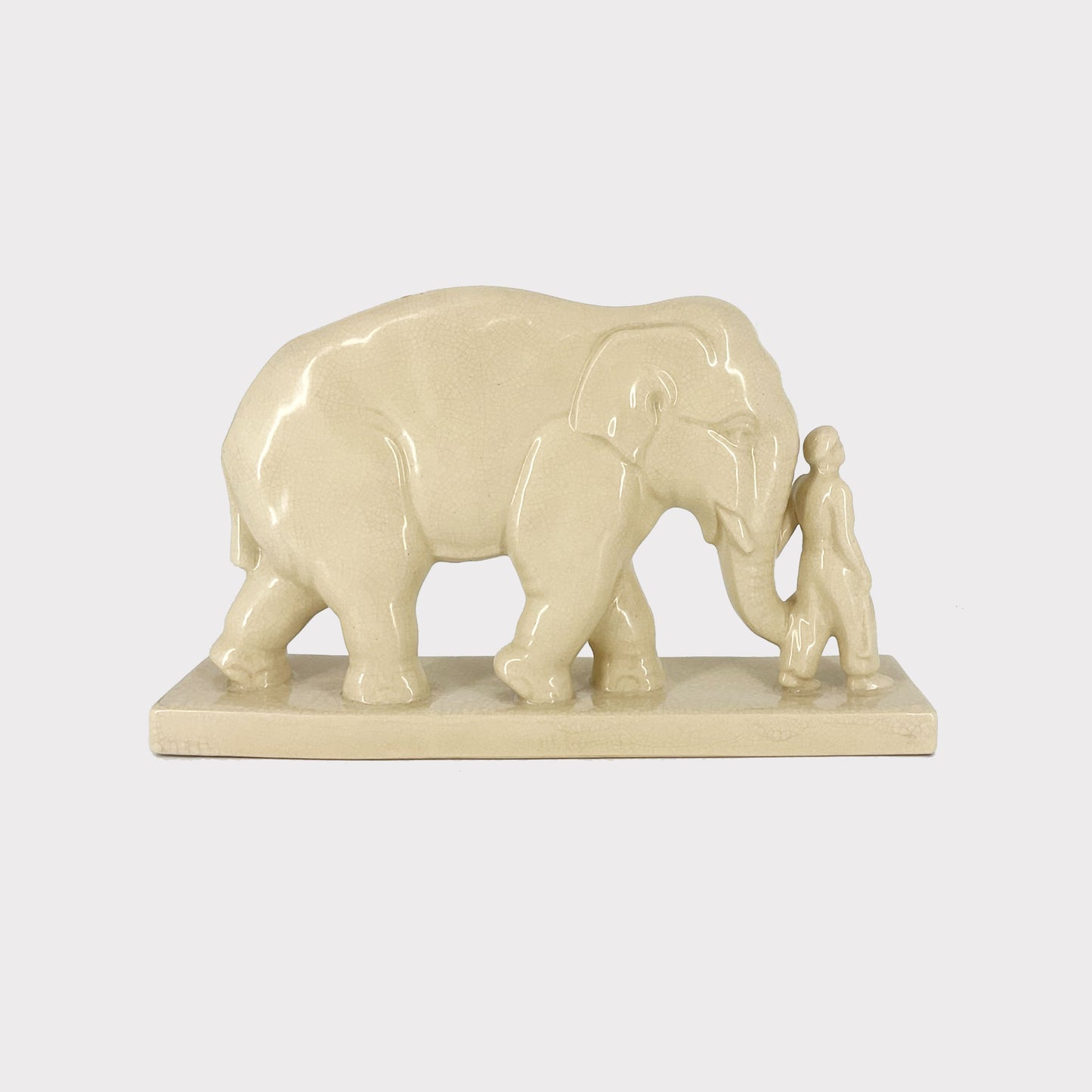 side view of Ivory Ceramic Elephant with Keeper Large Figurine