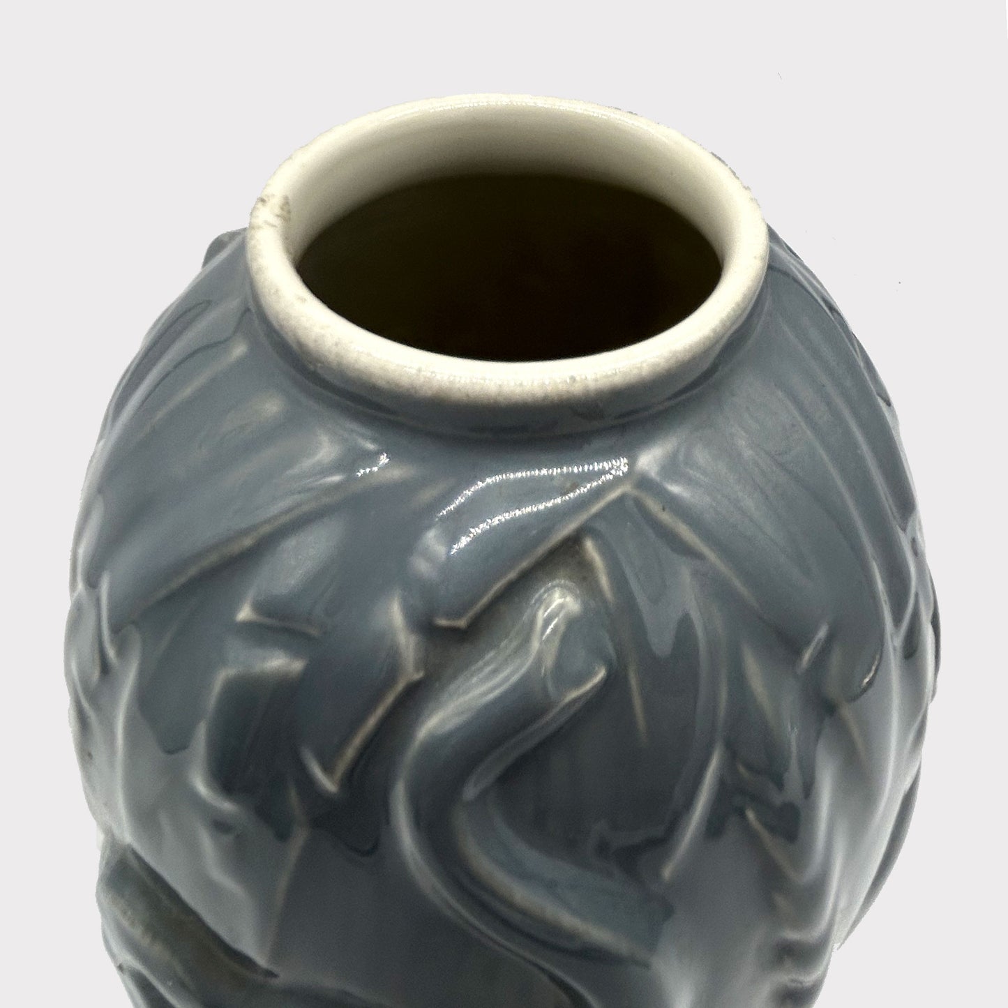 top rim of Art Deco Vase glazed in gray color with Elephant detail